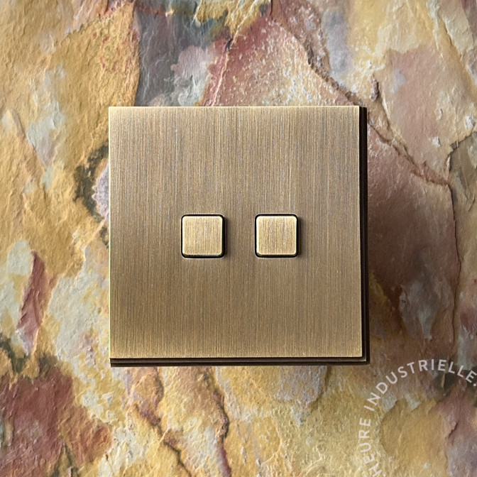 Interrupteur double Modelec Empreintes Angle - Vieux Bronze